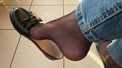 balcony shoeplay by Isabelle-Sandrine, she wears her black leather ballet flats, black nylons and jeans Thumb